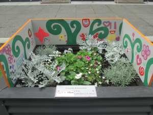 2014 Festival of Flowers planter box with artwork by kids from Te Puna Oraka’s holiday programme.